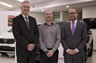 Travis Cross (centre) with Kia NZ GM, Todd McDonald, (left) and Andrew Simms Botany dealer principal, Matthew Wales (right) - PHOTO Christel Kelly Moore